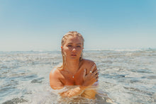 Model in the ocean, wearing the Freshwater Pearl Necklace, Ring and Earrings. 
