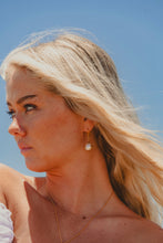 Model shot of Freshwater Pearl Earrings in gold.