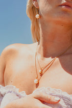 Close up of models neck with layer Freshwater Pearl Necklaces
