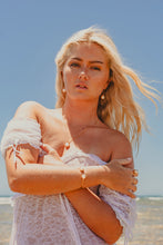 Model wearing the Freshwater Peal pieces.