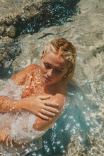 Model in the ocean adorned in the Freshwater Peal Ring and Bangle