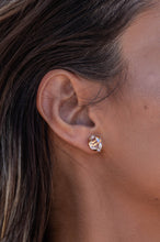 Close-up model shot of the Higher Realm Herkimer Diamond Stud Earrings in gold, showcasing the crystal clarity and radiant sparkle of the diamonds.