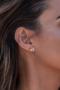 Close-up model shot of the Higher Realm Herkimer Diamond Stud Earrings in gold, showcasing the crystal clarity and radiant sparkle of the diamonds.