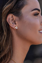 Close-up model shot of the Higher Realm Herkimer Diamond Stud Earrings in gold, showcasing the crystal clarity and radiant sparkle of the diamonds.