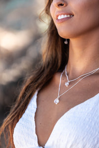 Close-up of the model wearing two Higher Realm Herkimer Diamond Crystal Necklaces in silver around her neck, showcasing the brilliance of the Herkimer diamonds.