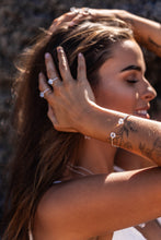 Close-up shot of the model wearing two Higher Realm Herkimer Diamond rings in silver, paired with the matching Herkimer Diamond bangle, showcasing the clarity and elegance of the diamonds.