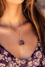 Extreme close-up of the Twilight Veil Amethyst Crystal Cluster Necklace in gold, resting on the model’s neck, highlighting the raw amethyst clusters and fine craftsmanship.