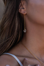 Close-up shot of the model wearing Herkimer Diamond thread earrings in gold.