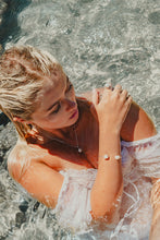 Model in the ocean wearing Freshwater Pearl Bangle 