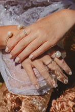 Model wearing Freshwater Pearl rings as well as other Blackwood Ave pieces for that layered look.